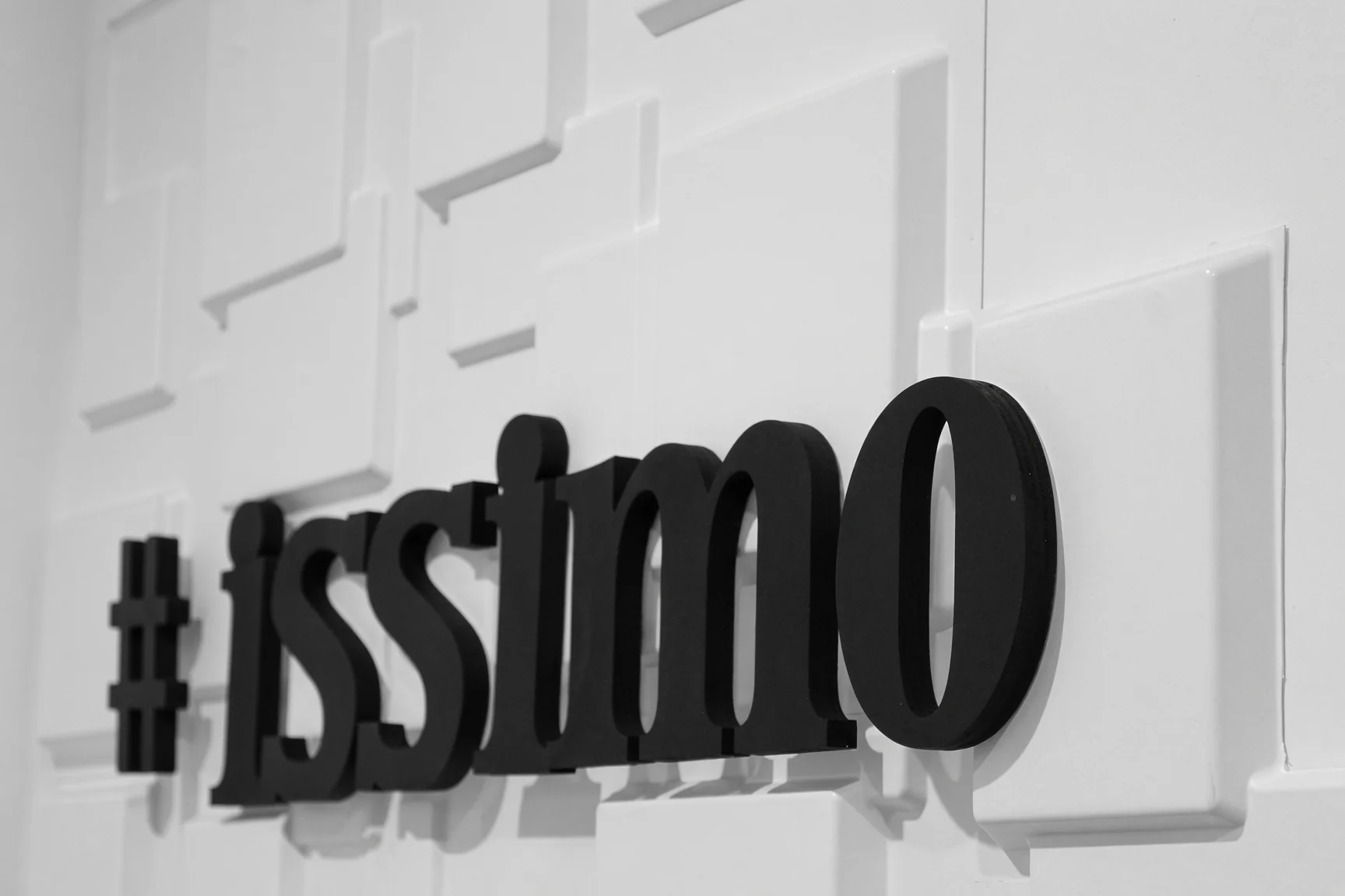 Black and white #issimo 3D sign, close