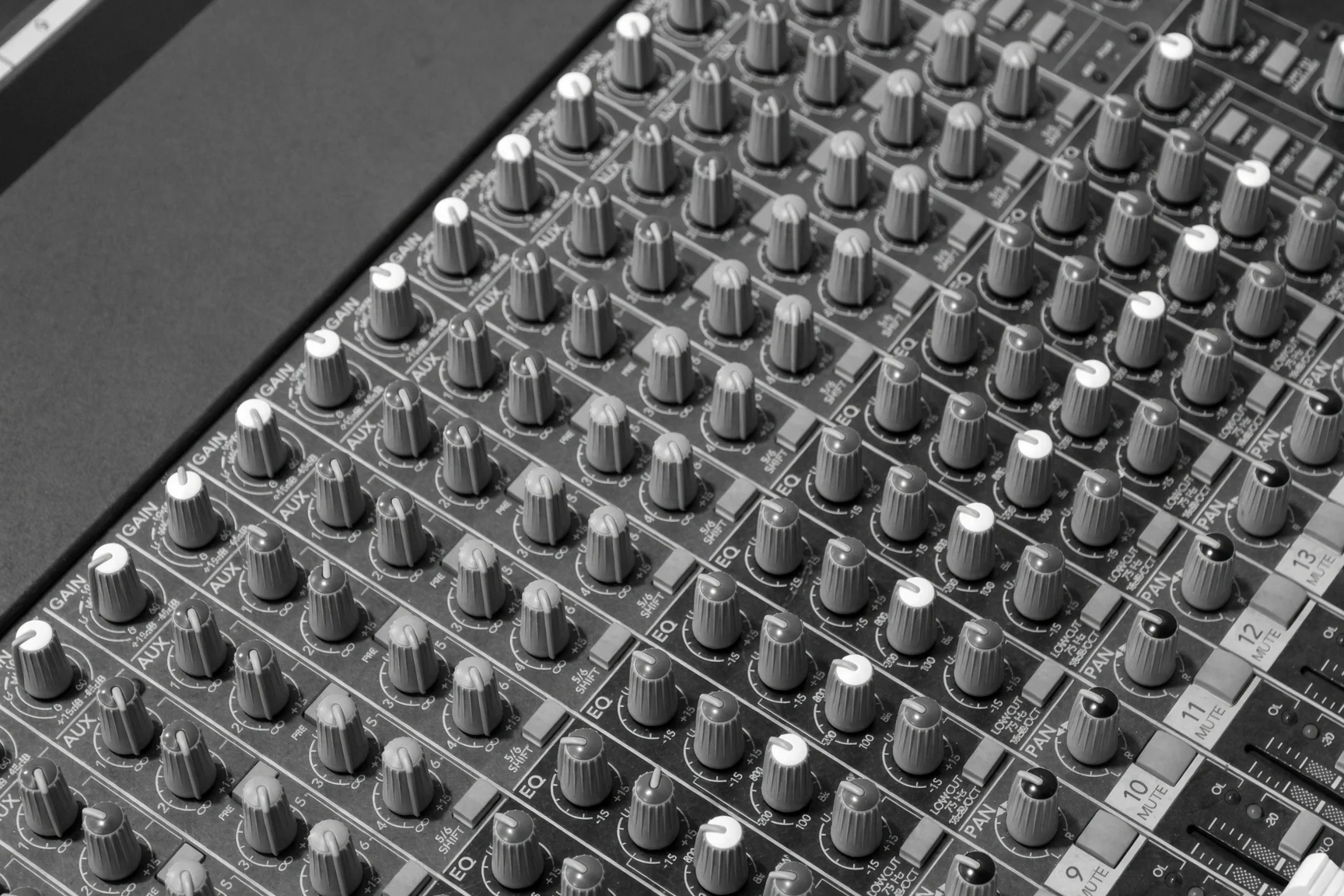 Close black and white view of the mixing console