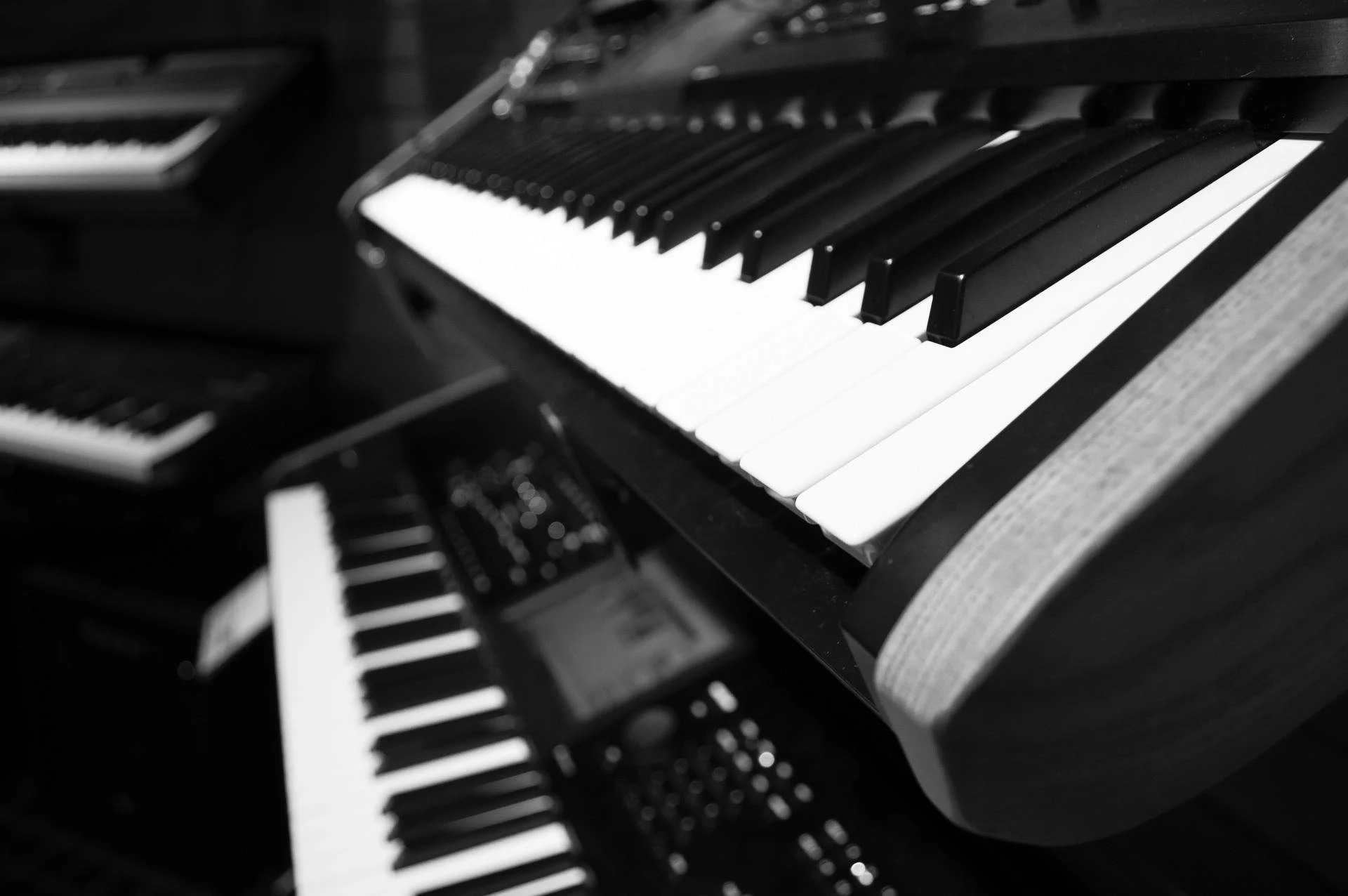 Stacked keyboards ready for a session